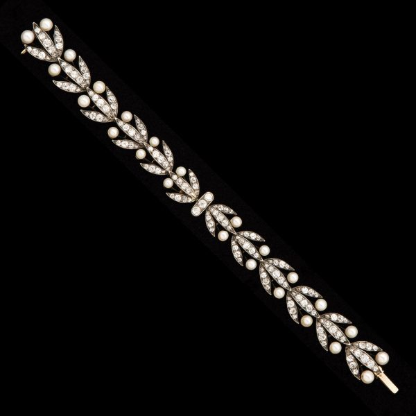 Belle Epoch diamond and pearl bracelet, with diamond set laurel leaf design, with 24 natural pearl berries. French c.1890