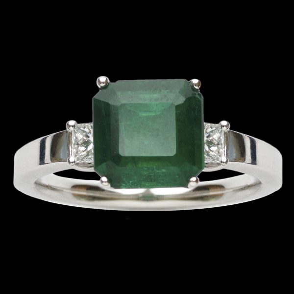 Modern emerald ring. Square step cut emerald 2.25ct with diamond set shoulders 2 = 0.30ct