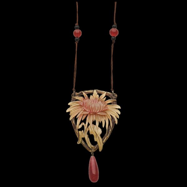 Art Nouveau carved horn pendant with chrysanthemum design and pink glass beads