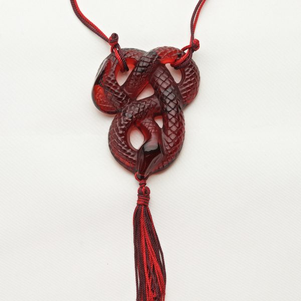 Red glass pendant in the form of a snake
