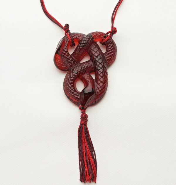 Red glass pendant in the form of a snake