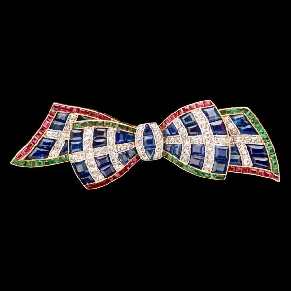 Art Deco bow brooch set with calibre rubies,sapphires and emeralds in a plaid design