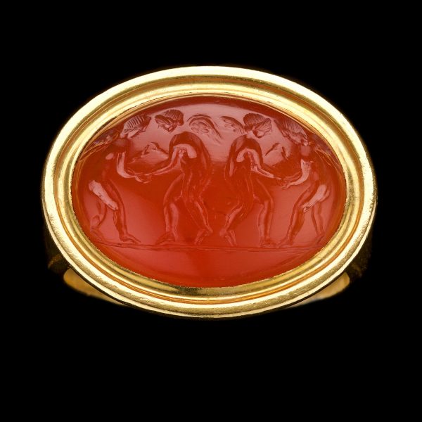 Cornelian intaglio carved with four dancing angels, 2nd century CE, 22ct gold mount