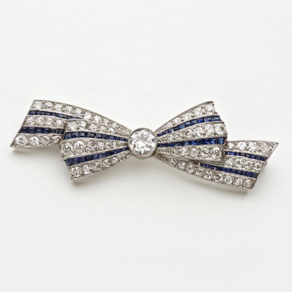Art Deco diamond and sapphire bow brooch, platinum setting