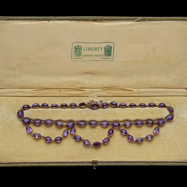 Late 19th century amethyst swag necklace, 18ct rose gold settings. In original case labelled Liberty London and Paris