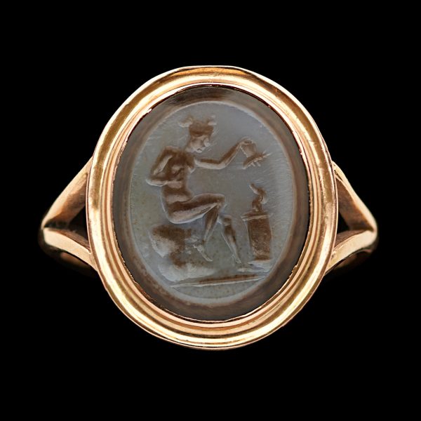 Sardonyx intaglio ring with the figure of a seated Aphrodite about to sacrifice a butterfly (Psyche) on a flame