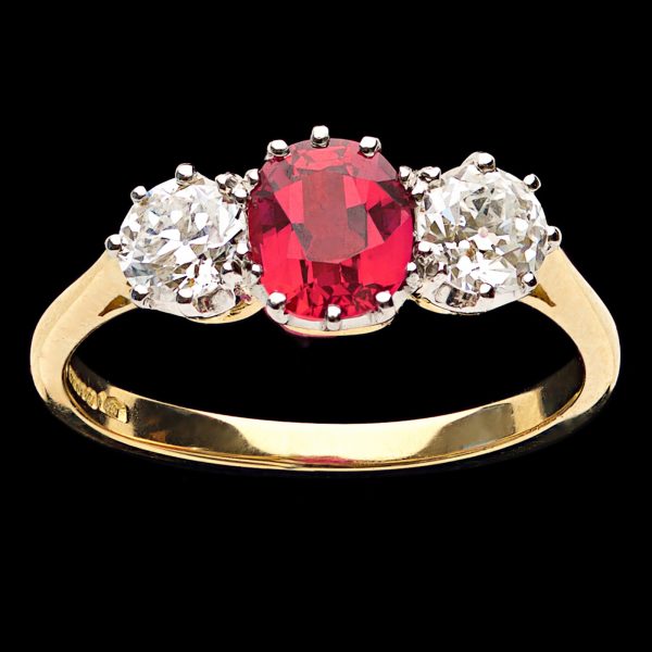Ruby diamond 3 stone ring, the ruby 1.08ct the diamonds total 0.76ct