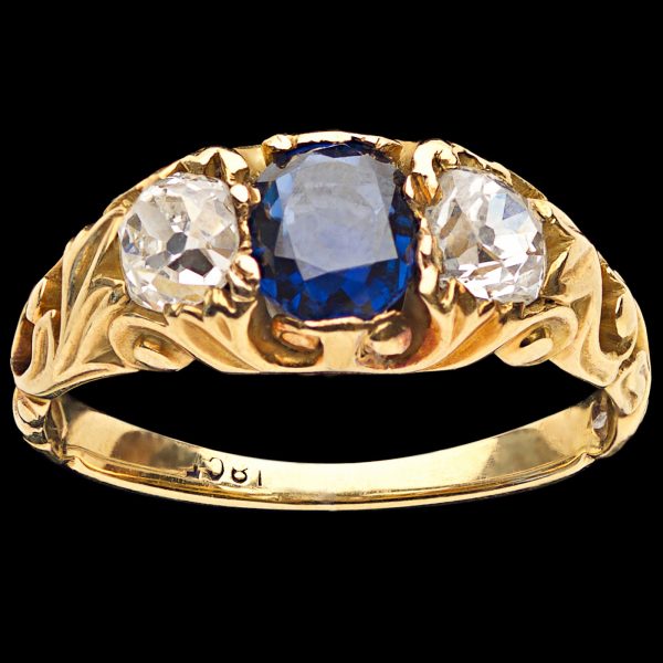 Antique sapphire and diamond ring, the sapphire 0.70ct, the diamonds 0.75ct total, G-H colour, 18ct yellow gold scrolled settings