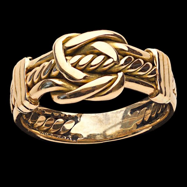 18ct rose gold keeper ring the design with central knot threaded with rope, hallmarked Chester 1898