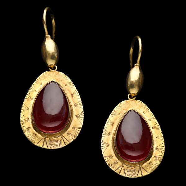 Antique gold pear shaped earrings set with almandine garnets, circa 1890