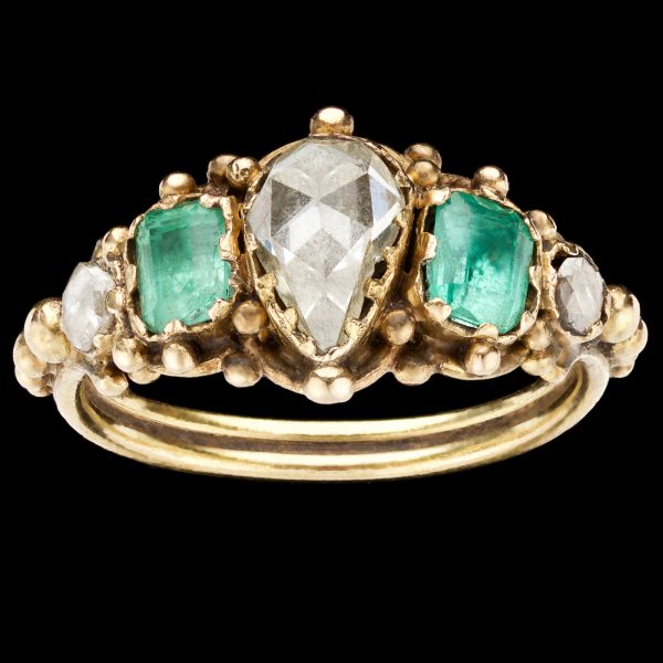 Georgian ring set with a heart shaped diamond and 2 emeralds