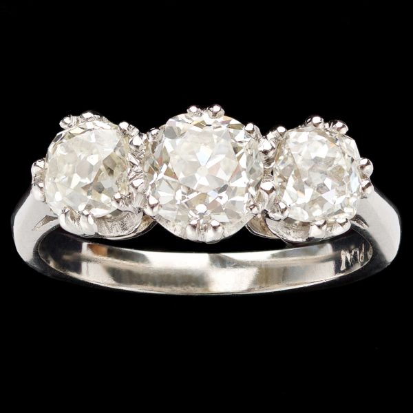 Classic 3 stone diamond ring, the central stone K-L, side stones = 1.30ct